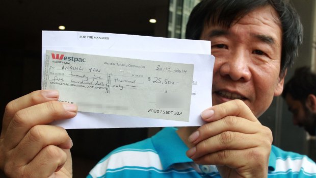 Cleaner Anping Yan leaving court, with a bounced cheque. 
