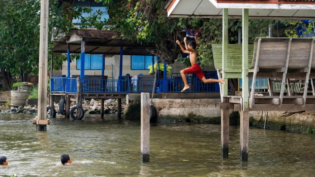 Children playing in the river reflect the relaxed vibe of Ko Kret. 