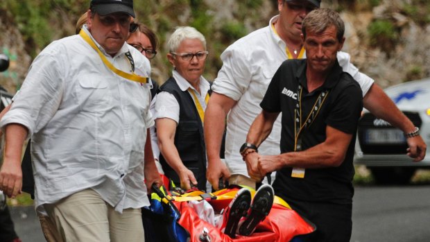 Australian BMC rider Richie Porte is carried to an ambulance.