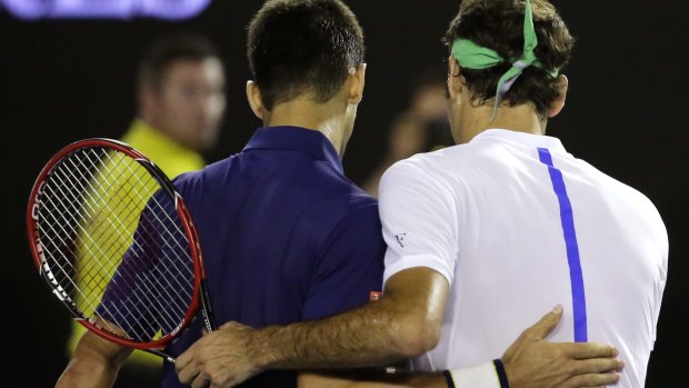 I'll be back: Federer congratulates Djokovic after their semi-final.