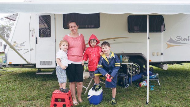 Catherine Kane with her three kids Matthew, Ben and James outside their grandparents' caravan in Cobbitty.