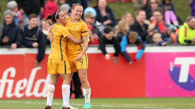 Caitlin Foord and Lisa De Vanna celebrate a goal against New Zealand.