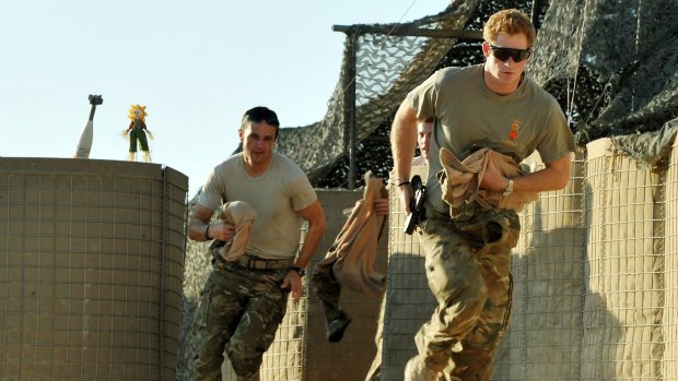 Prince Harry runs to scramble his Apache with fellow pilots in Camp Bastion, Afghanistan, on November 3, 2012.