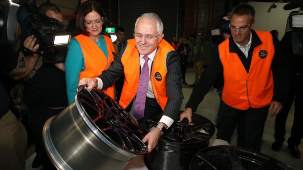 Prime Minister Malcolm Turnbull looked at a steel wheel during a visit to Carbon Revolution in Waurn Ponds. 