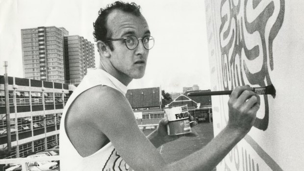 New York graffiti artist Keith Haring at work on the Collingwood Technical School wall in Johnston Street in March 1984.