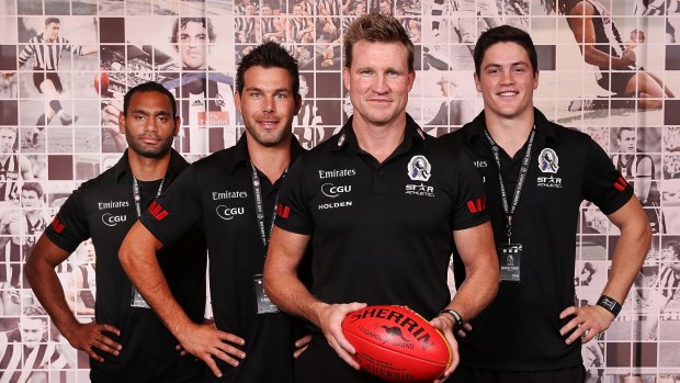 Collingwood coach Nathan Buckley with new recruits Travis Varcoe, Levi Greenwood and Jack Crisp.