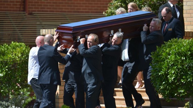 Penny Bailey's coffin is carried out of Our Lady of Good Counsel Church  in Deepdene on Thursday.