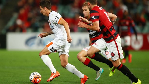 Catch me if you can: Jamie Maclaren leads the Wanderers a merry dance.