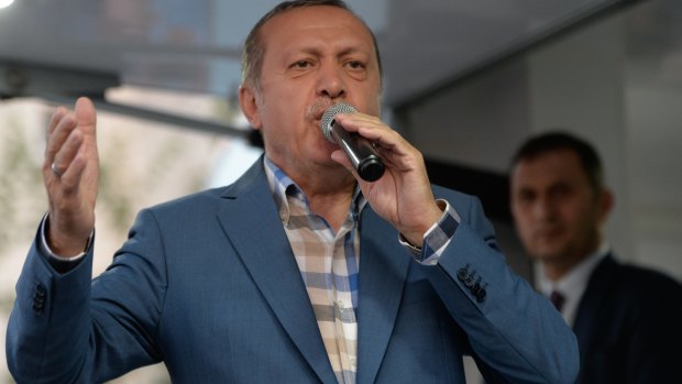 Turkish President Recep Tayyip Erdogan delivers a speech to his supporters in Istanbul.