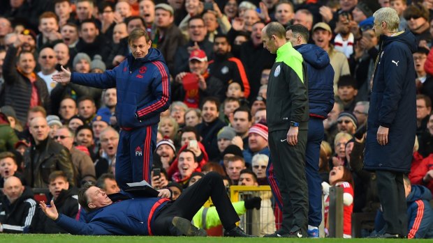 Free-fall: Manchester United and coach Louis van Gaal are falling fast down the ladder.