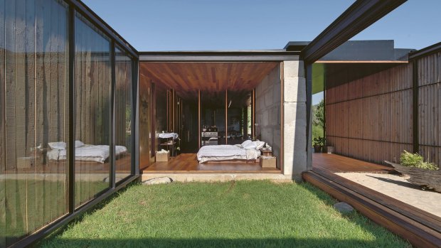 The small, grassy garden that leads from the bedroom is sheltered on two sides by the concrete block wall and connects to the verandah and the enclosed space behind it.