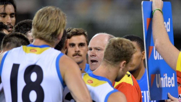 Rodney Eade talks to his players during a break.