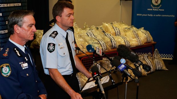 Major haul: NSW Police Commissioner Andrew Scipione and AFP Commissioner Andrew Colvin with a quarter of the drugs seized in the operation.