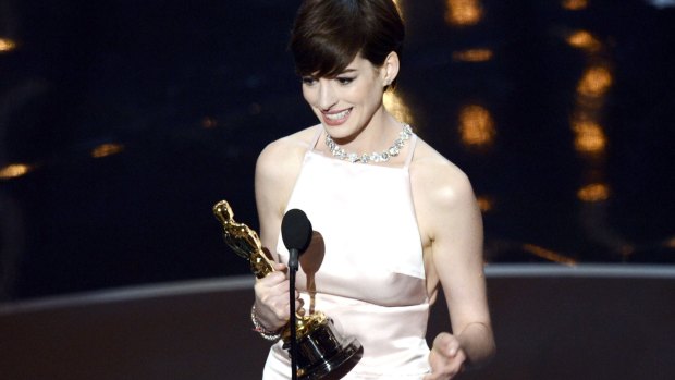 Anne Hathaway accepts the Best Supporting Actress award for <i>Les Miserables</i> at the 2013 Oscars.