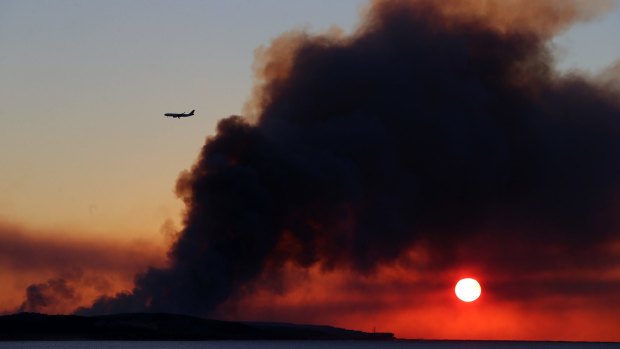 Smoke from a bushfire near Kurnell earlier this week, not far from Sydney Airport.