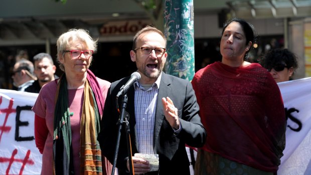 Federal Member for Melbourne Adam Bandt (centre) addresses a rally in support of asylum seekers on Manus Island.