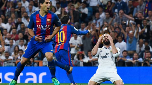 Real Madrid's Daniel Carvajal as Lionel Messi (No.10) celebrates his matchwinning goal.