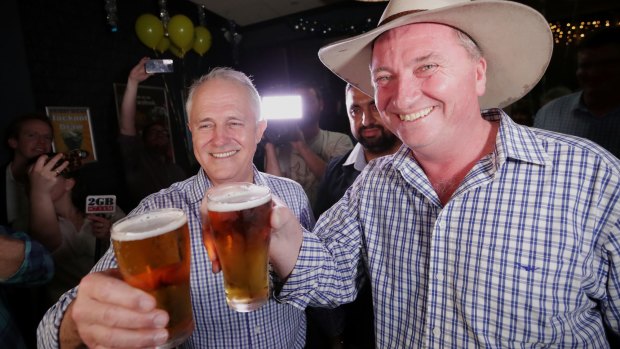 Prime Minister Malcolm Turnbull and Barnaby Joyce celebrate on Saturday.