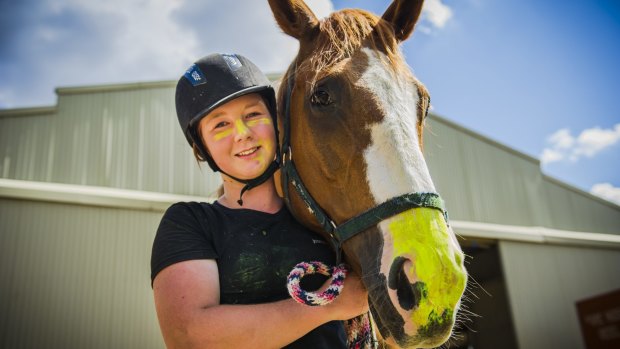 Heat cheaters: Flynn, a horse at the National Equestrian Centre, and his rider Jasmine Allday, 15, wear zinc on their noses as protection from the hot summer sun.