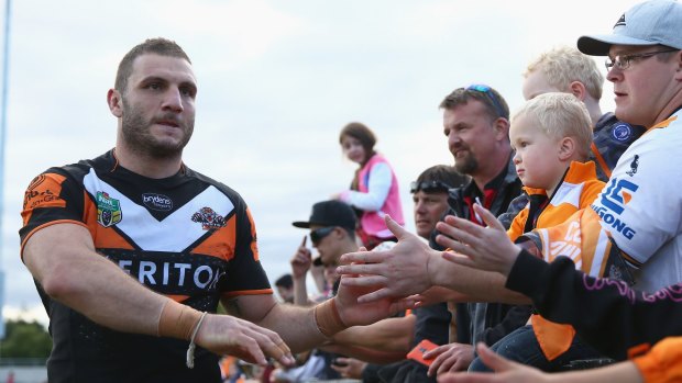 On the outer: Robbie Farah has been told he can look elsewhere by Wests Tigers, but he doesn't want to leave and the fans don't want him to go.