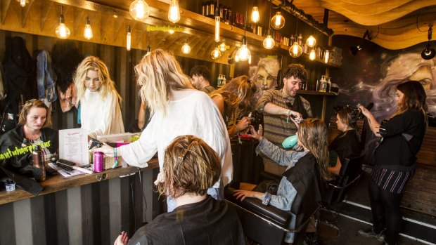 Riding the blow-wave: Festivalgoers get their hair fixed at Splendour in the Grass.