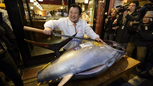 Sushi anyone? ... Kiyoshi Kimura, President of Kiyomura K.K., poses with the 180-kilogram tuna - which sold for 4.51 million yen ($46,540) at the year's first auction at Tsukiji Market.