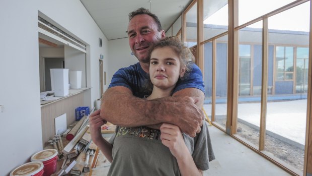Canberra Raiders coach Ricky Stuart, pictured with his 18-year-old autistic daughter Emma at his respite house, wants Pauline Hanson to give disabled children a "fair go".