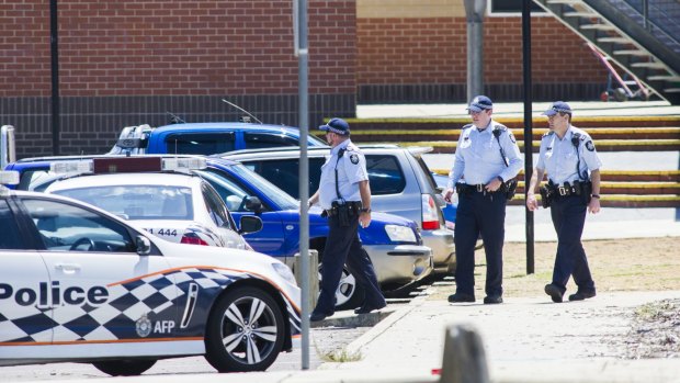 ACT Policing officers outside Lanyon High School on Tuesday following a bomb threat.