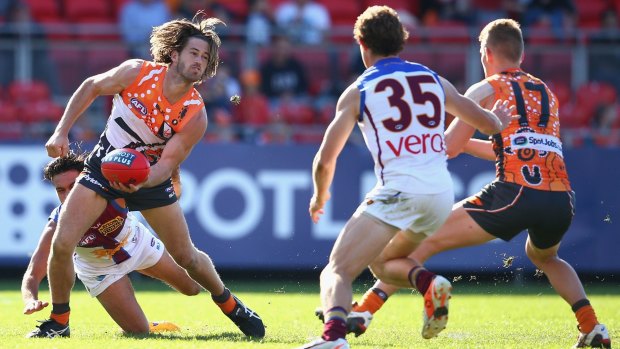 Looking for support: Callan Ward looks to handpass during the Giants' recent clash with the Brisbane Lions at Spotless Stadium.