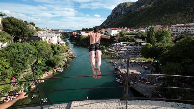 A diver jumps from the Old Mostar Bridge during the 454th traditional annual high diving competition, in Mostar, Bosnia.