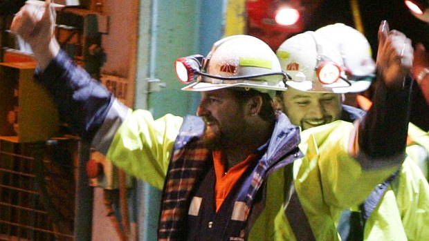 Miners Todd Russell, left, and Brant Webb, smile as the arrive above ground after spending two weeks trapped underground.