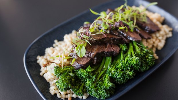Angus beef cheeks are 12 hours braised, with pearls of cous cous, and broccolini.