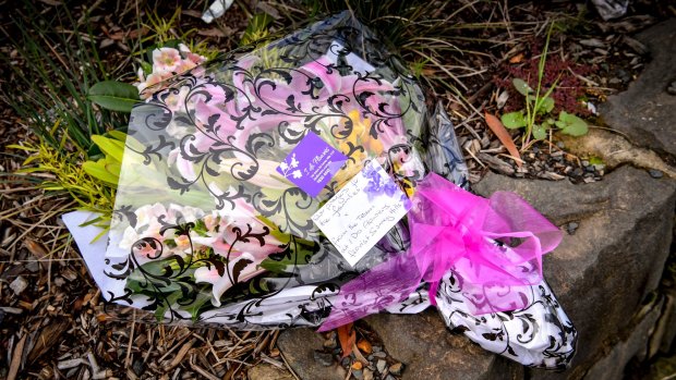 Flowers at the scene of the fatal crash at Surrey Hills train station.
