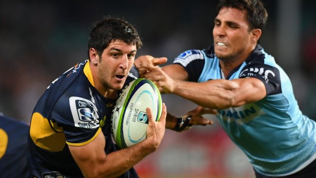 Big improver: Brumbies scrumhalf Tomas Cubelli is tackled by Nick Phipps of the Waratahs.