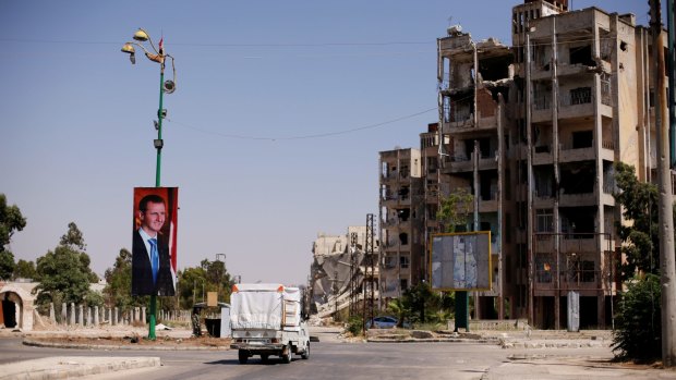 A picture of Syria's President Bashar al-Assad is seen in Waer district in the central Syrian city of Homs, Syria, in July.
