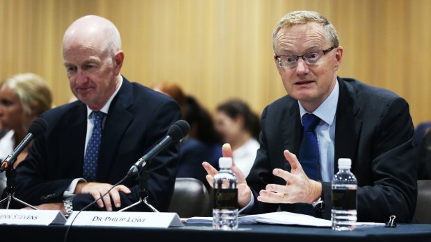Outgoing governor Glenn Stevens leaves his (then) deputy Philip Lowe to answer at a parliamentary hearing earlier this year.