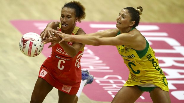 Australia's Kim Ravaillion battles England's Serena Guthrie.