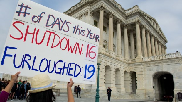 A government employee protests over the shutdown at the US Capitol in 2013.