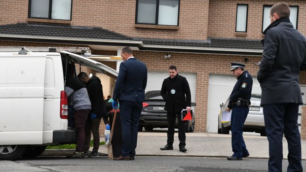Police raid a home in Greenacre in Sydney's south-west after a 24-year-old man was arrested over the murder of Hamad Assaad.