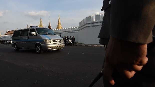 The body of King Bhumibol Adulyadej arrives at the Grand Palace in Bangkok on Friday.