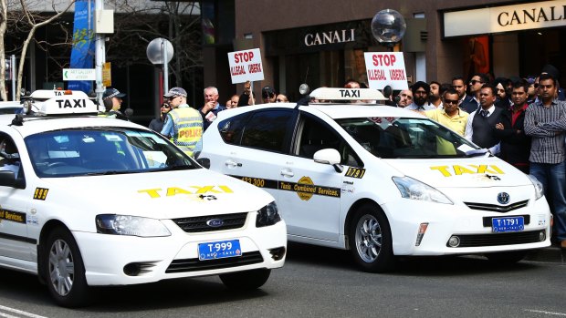 Taxi drivers protest against Uber at the NSW State Parliament this month. 