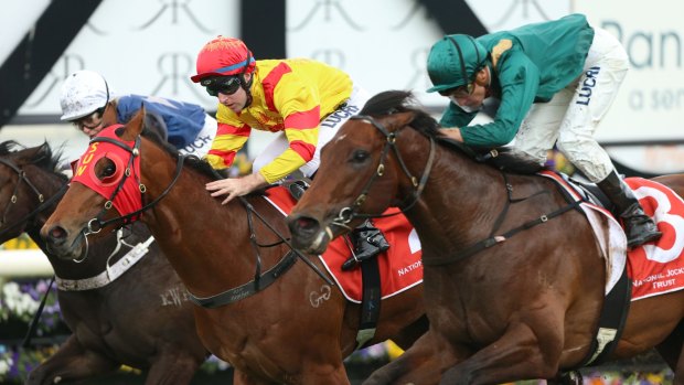 Late arrival: Mediterranean (green colours) swoops home late for second to Thronum in the Rosebud at Rosehill.