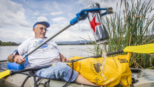 Tuggeranong Lake Carers Group member Bill Perry uses his kayak to remove rubbish from the lake.

Canberra Times photo by Matt Bedford