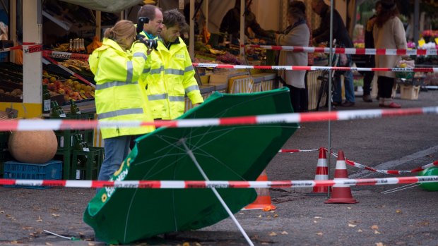 Police investigate the scene of the attack in Cologne.
