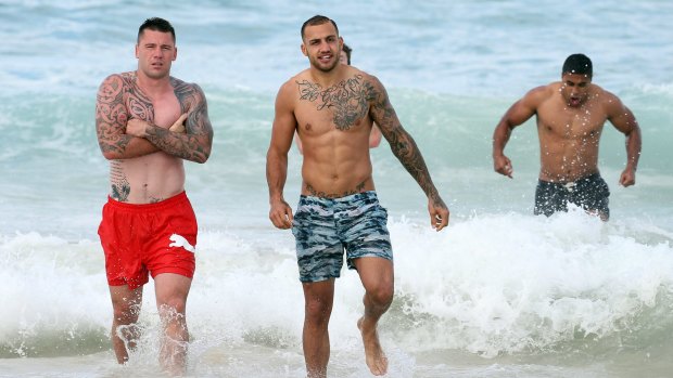 Playing it cool: (From left) Shaun Kenny-Dowall, Blake Ferguson and Michael Jennings hit Bondi after Friday night's win over the Bulldogs.