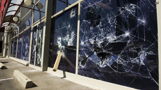 Smashed windows at the WIN TV building on Wentworth Ave, Kingston.
