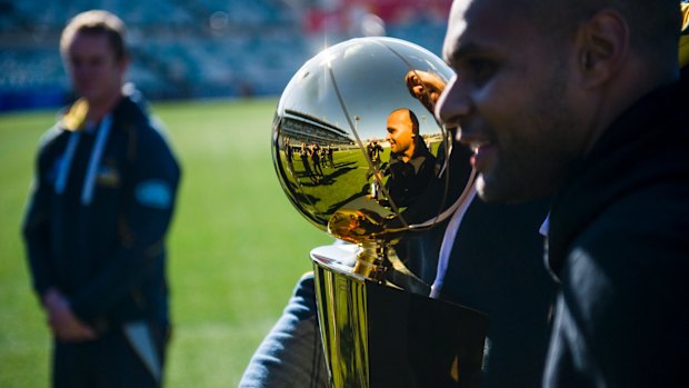 Patrick 'Patty' Mills visits the Brumbies at their training session at GIO Stadium ahead of their clash against the Chiefs.
Patrick Mills and Fotu Auelua reflected in the NBA trophy.
