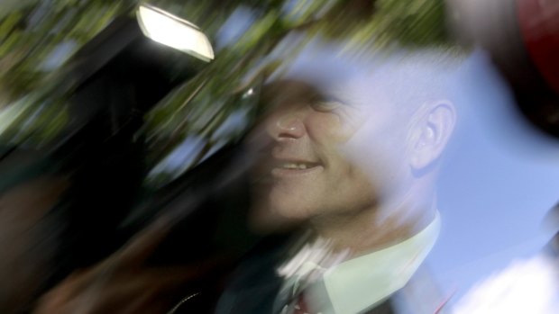 Premier Campbell Newman leaves Government House.