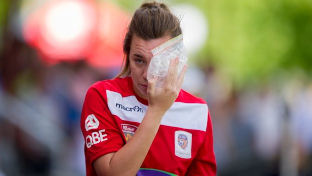 Glory keeper MacKenzie Arnold after copping a nasty hit from United's Michelle Heyman during a match. 