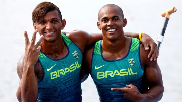Brazil's three-time medallist Isaquias Queiroz, left, and Erlon De Souza Silva celebrate their silver in the men's canoe double 1000m final in Rio on Saturday.